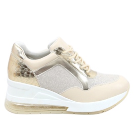 Scarpe sportive su una zeppa nascosta beige e oro RQ288 Beige d'oro