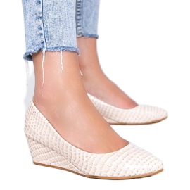 Décolleté beige con motivo a pelle di coccodrillo sulla zeppa Wildlife