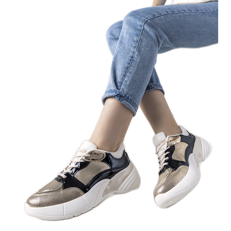 Sneakers dorate con suola alta Rude nero