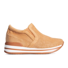 Sneakers con zeppa arancioni di Mina arancia