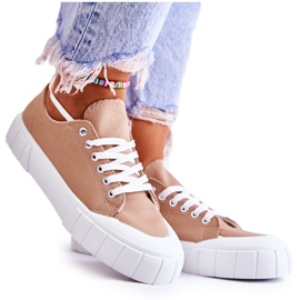 Sneakers da donna sulla piattaforma marrone arriva