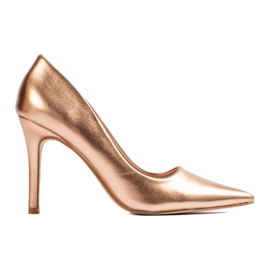 Tacchi alti dorati da donna d'oro