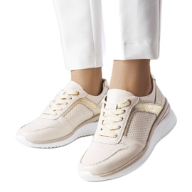 Scarpe in pelle traforata beige Trás