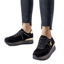 Sneaker nere e dorate sulla piattaforma Elliott nero