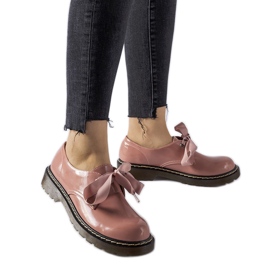 Scarpe rosa con fiocco decorativo di Rodriguez