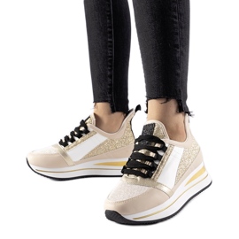 Sneakers beige glitterate sulla piattaforma Marcè