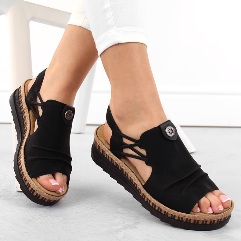 Comodi sandali slip-on da donna neri con zeppa Rieker V7972-00 nero