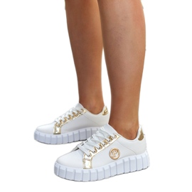 Sneaker bianche e dorate con massiccia suola Bionda bianca
