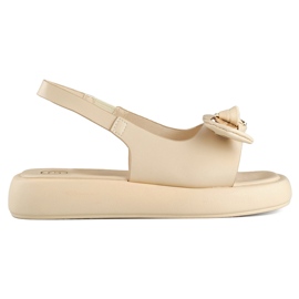 Sandali da donna beige con fiocco in orsetto sulla zeppa