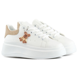 Scarpe sportive bianche con suola spessa e un orsacchiotto beige bianco