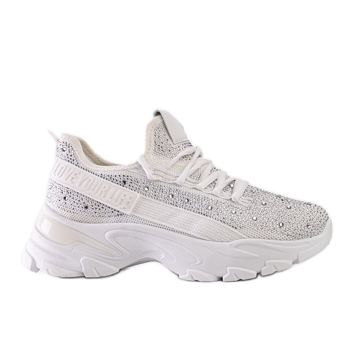 Sneakers bianche lucide con un'enorme suola Senai bianca