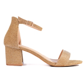 Sandali dorati con tacco alto e glitter d'oro