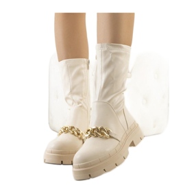 Stivali beige con suola alta
