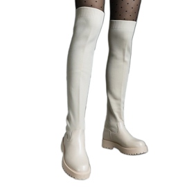 Stivali beige chiaro con tomaia flessibile e tacco piatto