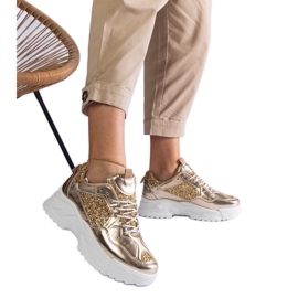Sneaker da donna dorata con inserti glitter d'oro