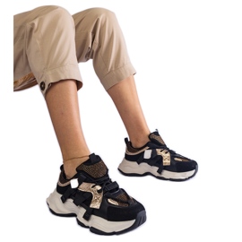 Sneakers nere con inserti dorati nero