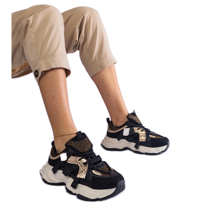 Sneakers nere con inserti dorati nero