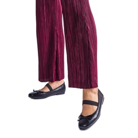 Ballerine nere con una fascia elastica e un arco decorativo nero