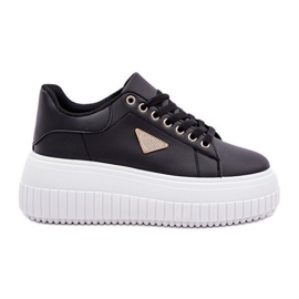 Sneaker eleganti su un'enorme piattaforma in bianco e nero