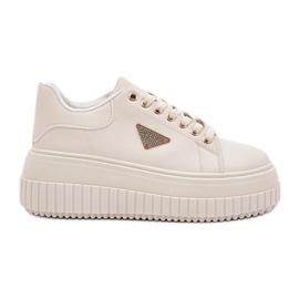 Sneaker eleganti su un'enorme piattaforma beige leggera