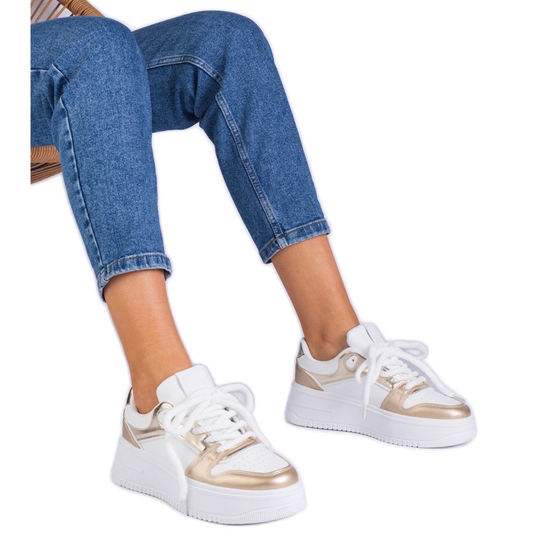 Sneakers con plateau bianche e dorate d'oro