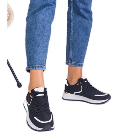 Sneaker da donna nera con un inserimento dorato nero