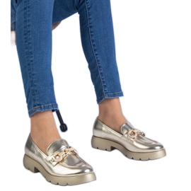 Scarpe classiche dorate con decorazione dorata d'oro