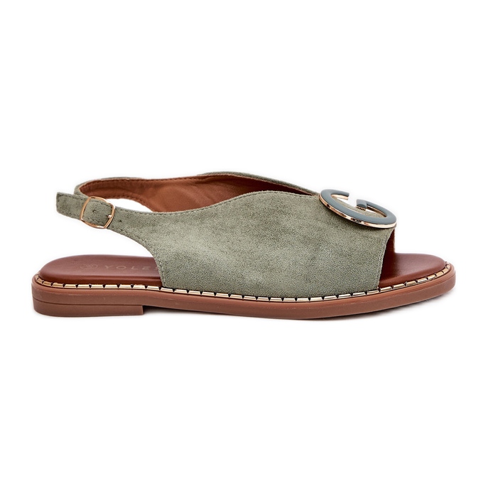 Sandali piatti con un ornamento verde