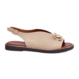 Sandali a ruota piatta con un ornamento di beige in pelle ecologica