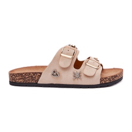 Pantofole da donna su una suola di sughero con fibbie e spille beige
