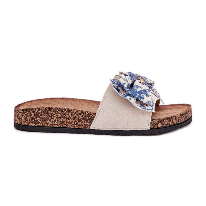 Pantofole da donna con un arco sulla piattaforma di sughero blu beige