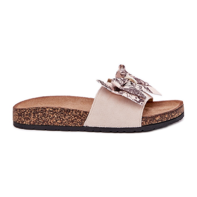 Pantofole da donna con un arco su una piattaforma di sughero beige