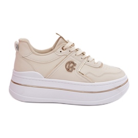 Scarpe sportive femminili sulla piattaforma beige