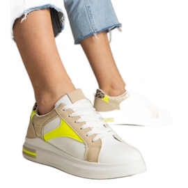 Sneaker da donna bianca con l'aggiunta di glitter e leopardi bianco