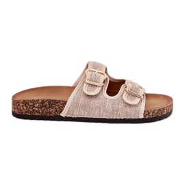 Le infradito del materiale delle donne su una piattaforma di sughero con fibbie beige