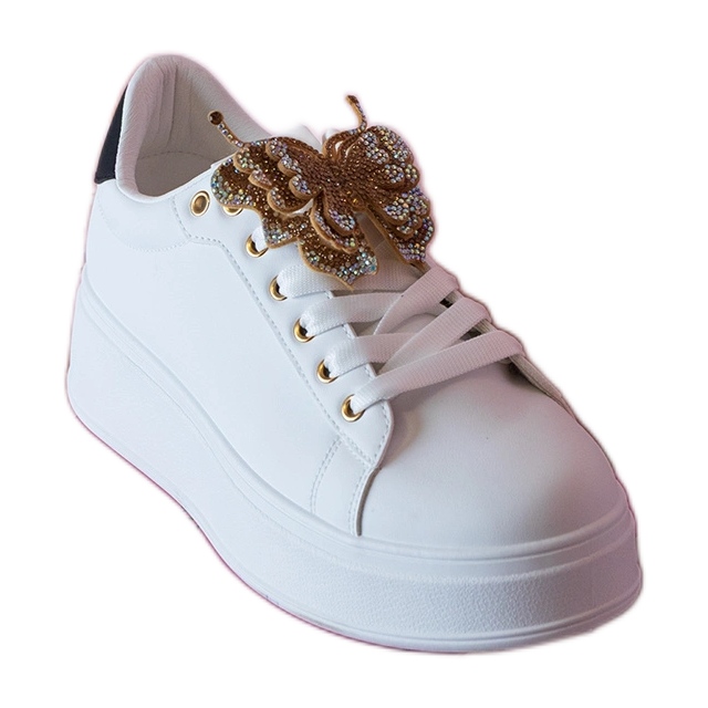 Sneaker in bianco e nero decorate con una farfalla con zirconi bianca