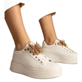 Sneaker bianche decorate con una farfalla con zirconi bianco