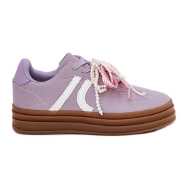 Sneaker femminili sulla piattaforma con decorazioni viola