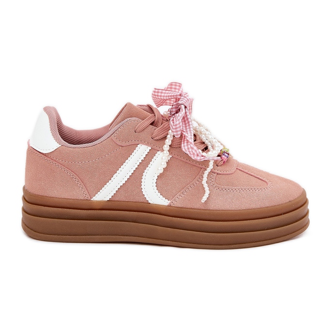 Sneaker femminili sulla piattaforma con decorazioni rosa