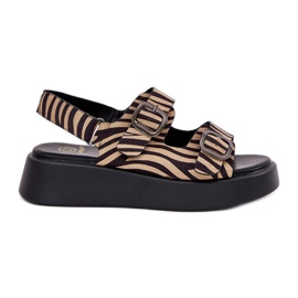 Sandali femminili sulla piattaforma e zeppe con fibbie zebra beige-nero