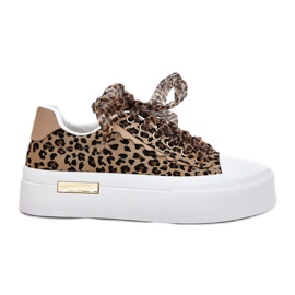 Sneaker femminili su una piattaforma enorme con leopardo marrone allacciata decorativa
