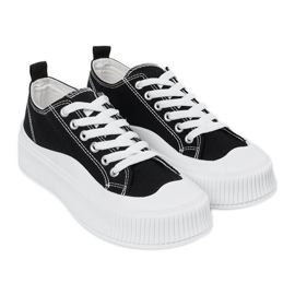 Sneakers bianche e nere con suola spessa nero