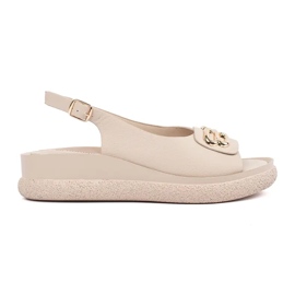 Goodin Sandali piatti beige con un ornamento