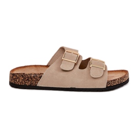 Infradito da donna su una piattaforma di sughero con morsetti dorati beige
