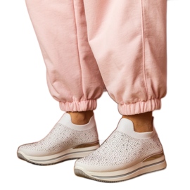 Sneaker da donna bianca sulla piattaforma con zirconi bianco