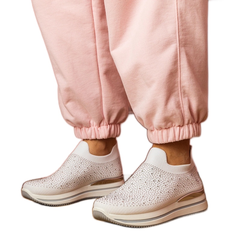 Sneaker da donna bianca sulla piattaforma con zirconi