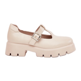 Scarpe da donna con una fibbia sulla piattaforma e tacchi piatti beige