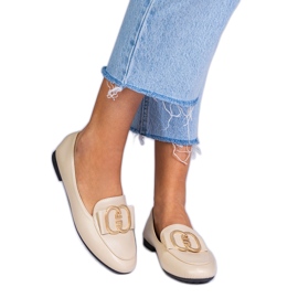 Mocassini da donna beige con una decorazione dorata