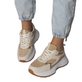 Sneaker sportive beige con un inserto intrecciato