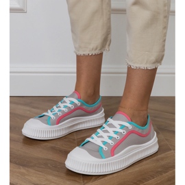 Sneaker da donna grigia sulla piattaforma grigio